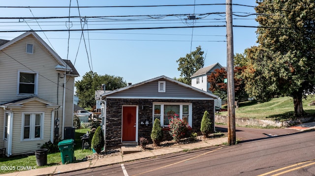 view of front facade featuring stone siding