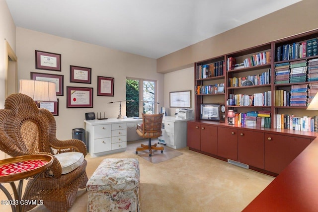 office area with light carpet and visible vents