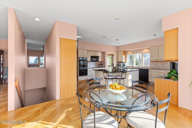 dining room featuring recessed lighting