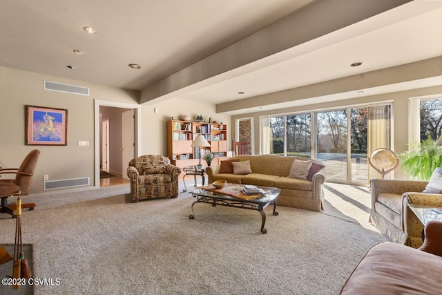 living area featuring a healthy amount of sunlight, visible vents, and recessed lighting