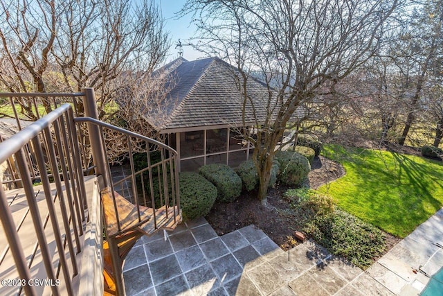 exterior space with a lawn and a gate