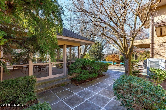 view of patio / terrace with a sunroom