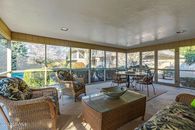 sunroom with a healthy amount of sunlight and visible vents