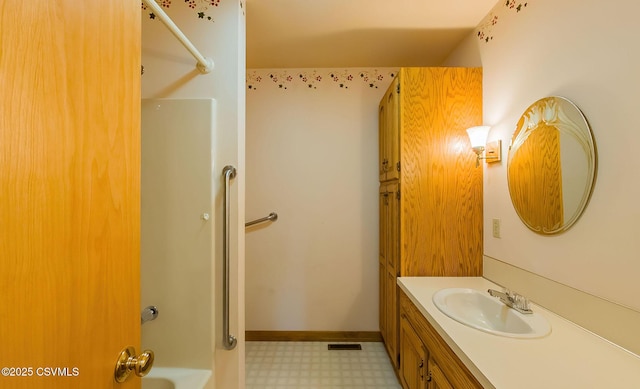 bathroom with visible vents, baseboards, shower / tub combination, tile patterned floors, and vanity