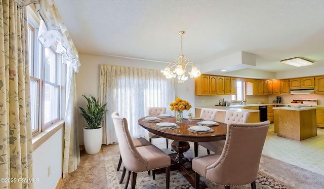 dining space featuring a chandelier