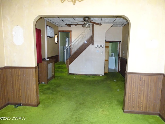 349 W 2nd St, Mount Carmel, PA 17851 - hallway with stairway, carpet floors, a wainscoted wall, and arched walkways