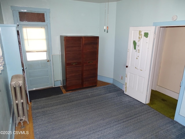 349 W 2nd St, Mount Carmel, PA 17851 - bedroom featuring radiator heating unit and carpet floors