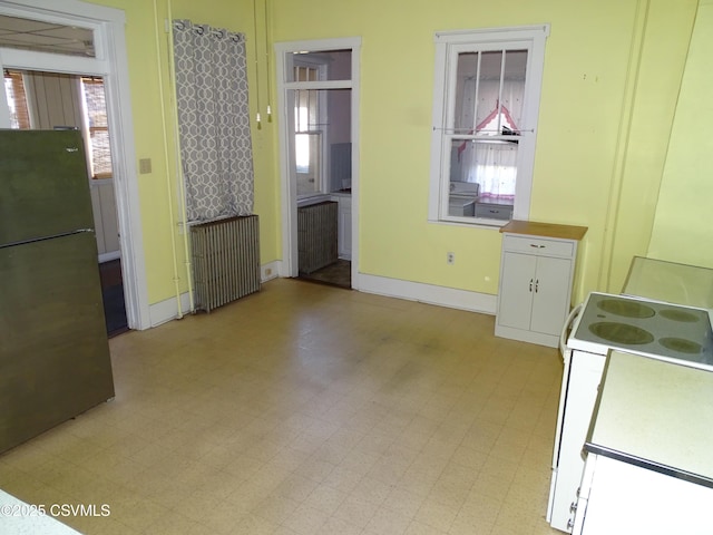 349 W 2nd St, Mount Carmel, PA 17851 - unfurnished dining area featuring radiator heating unit, light floors, and baseboards