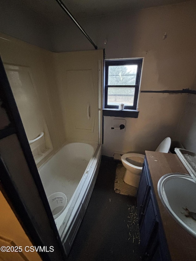 bathroom featuring tub / shower combination, vanity, and toilet