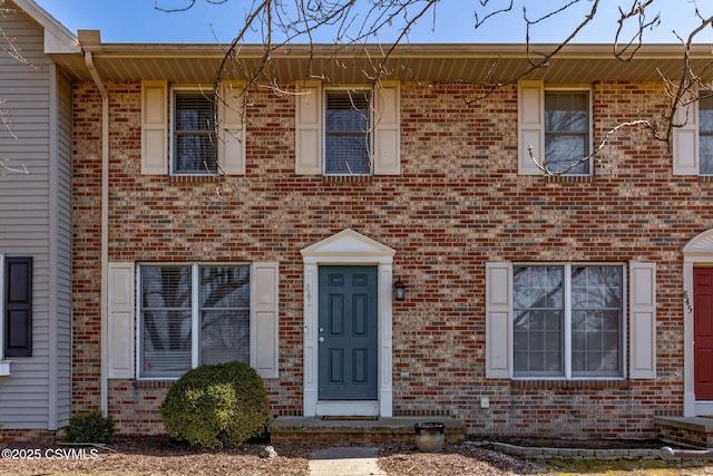 townhome / multi-family property with brick siding