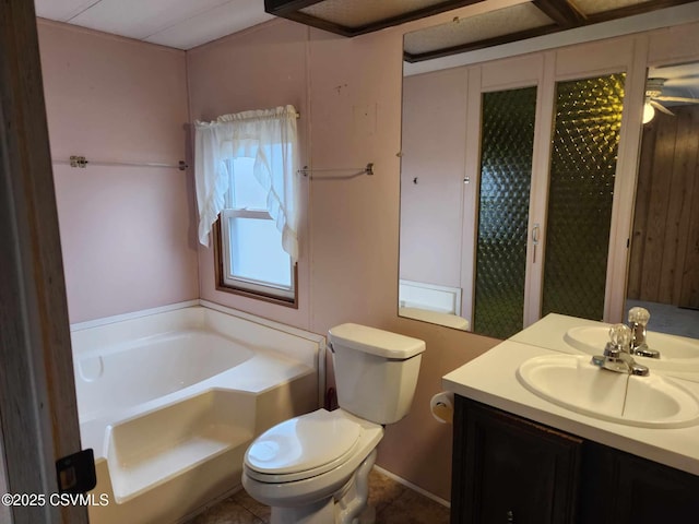 full bath featuring a bath, tile patterned flooring, toilet, and vanity