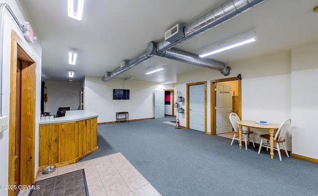 interior space with visible vents, carpet floors, and baseboards