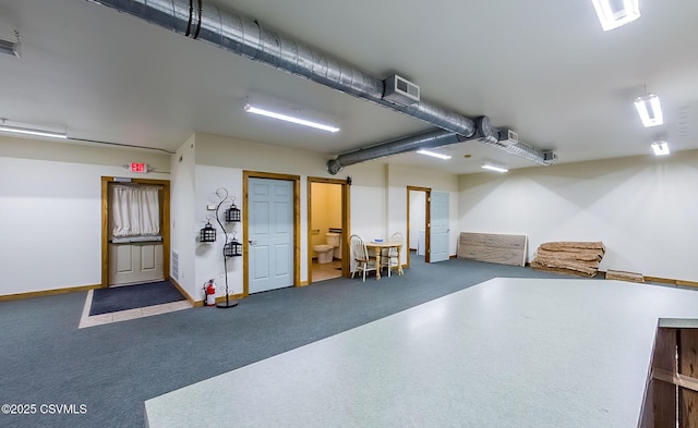 garage featuring visible vents and baseboards