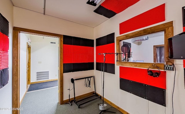 miscellaneous room featuring visible vents and baseboards