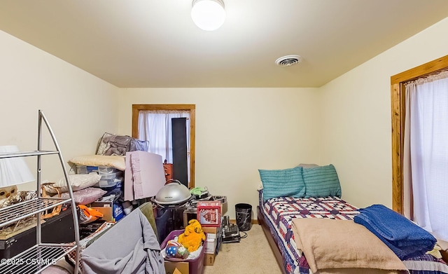 carpeted bedroom with visible vents