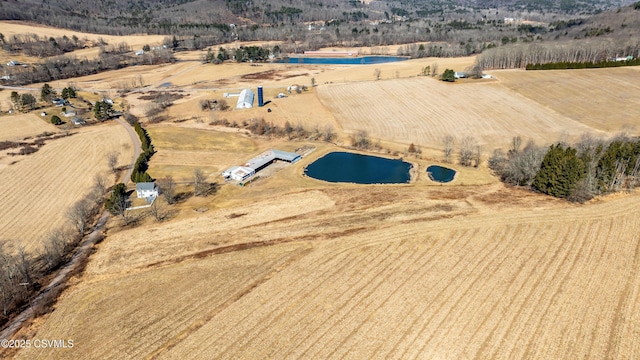 birds eye view of property with a rural view