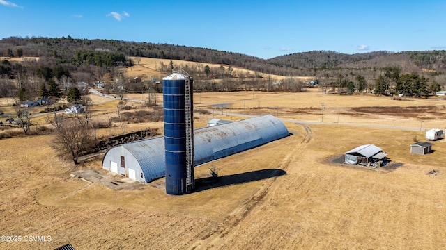 birds eye view of property featuring a mountain view and a rural view