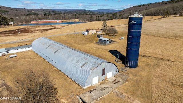 drone / aerial view with a mountain view and a rural view