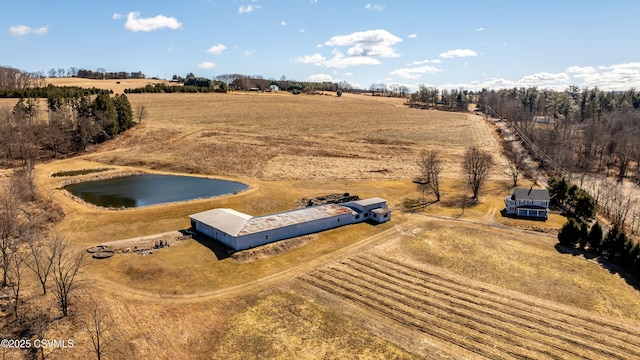 birds eye view of property featuring a water view and a rural view