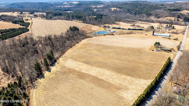 birds eye view of property with a rural view