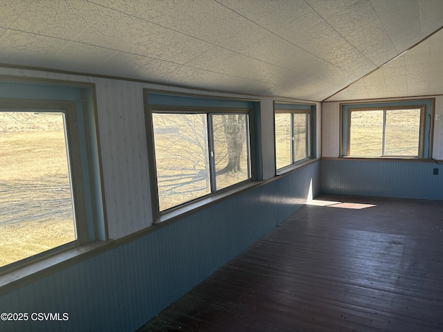 unfurnished sunroom with lofted ceiling