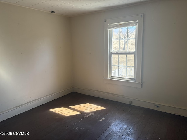 unfurnished room featuring dark wood-style floors