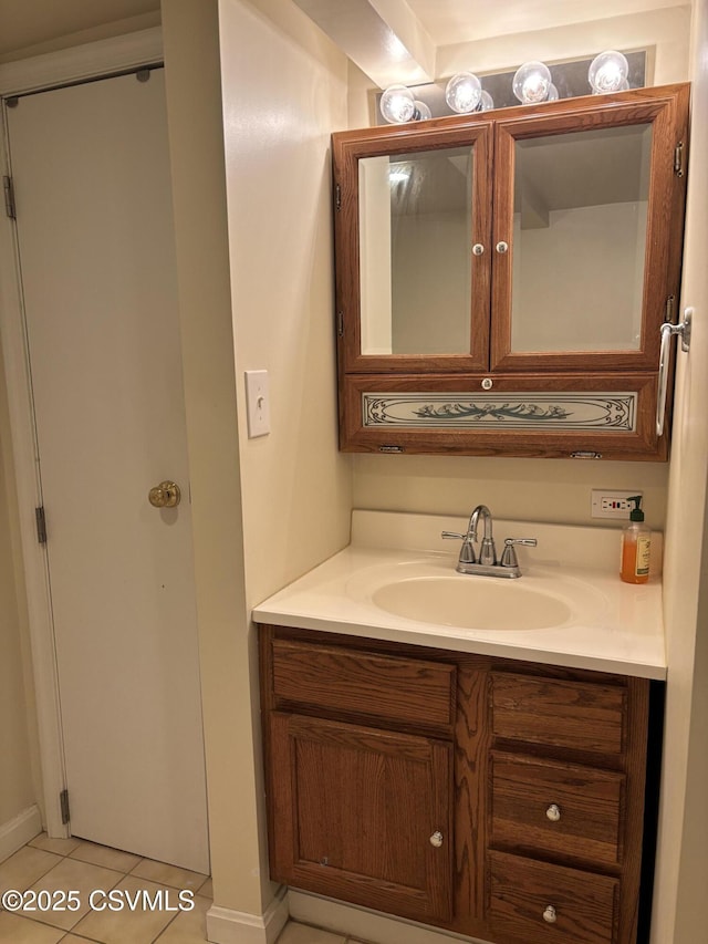 bathroom with tile patterned floors and vanity