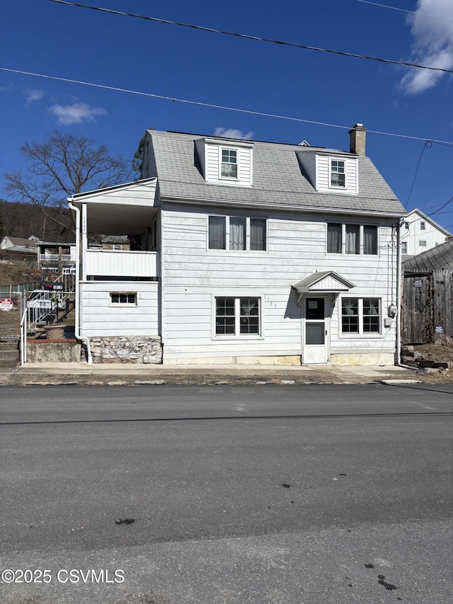 view of front of home with a chimney