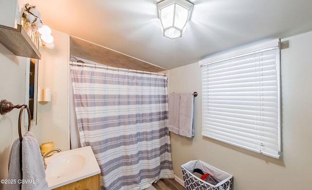 bathroom with a shower with curtain and vanity