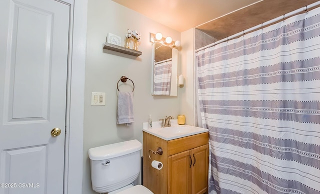 bathroom with a shower with shower curtain, toilet, and vanity