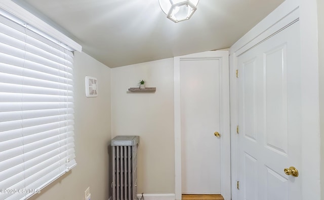 hallway featuring radiator heating unit