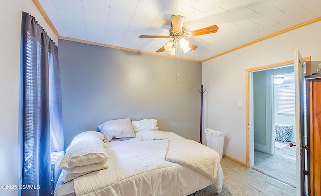 bedroom with light colored carpet, a ceiling fan, crown molding, and baseboards