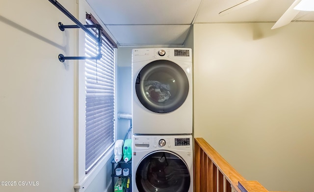 laundry room with laundry area and stacked washer / drying machine