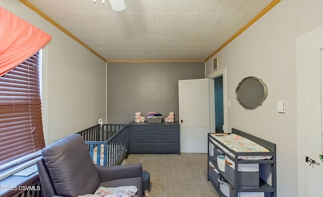 carpeted bedroom featuring visible vents and crown molding