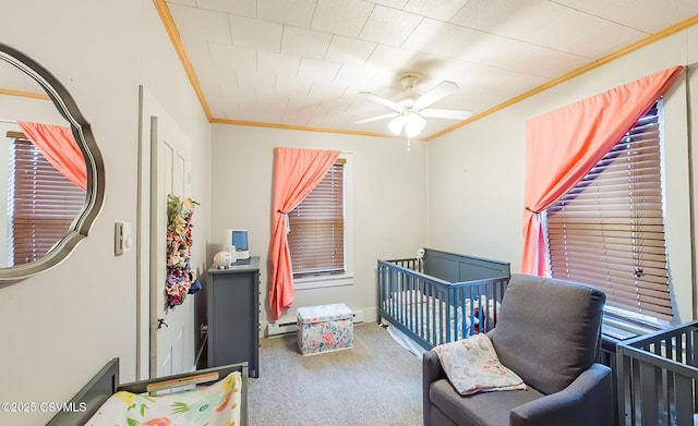 bedroom featuring a ceiling fan, a baseboard radiator, carpet floors, and ornamental molding