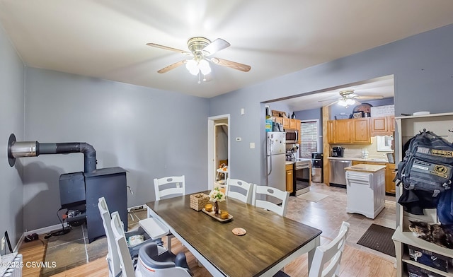 dining space featuring a ceiling fan