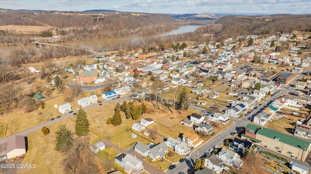 drone / aerial view featuring a residential view and a water view