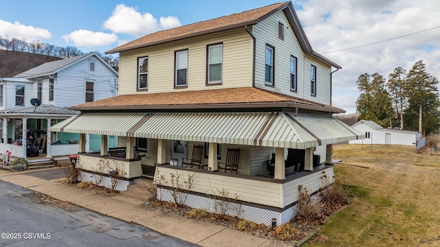 view of front of home with a porch and a shingled roof