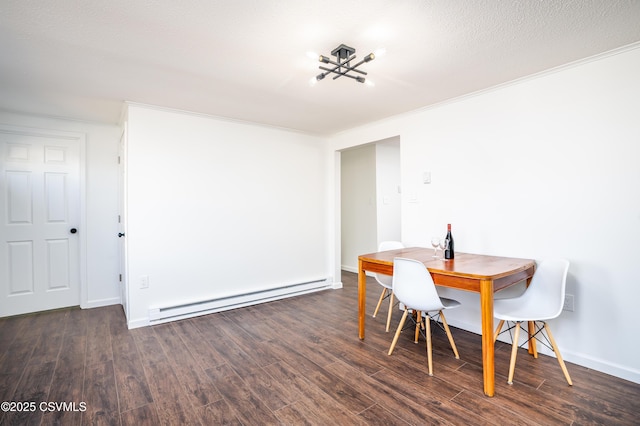 dining room featuring a baseboard radiator, baseboards, wood finished floors, and crown molding