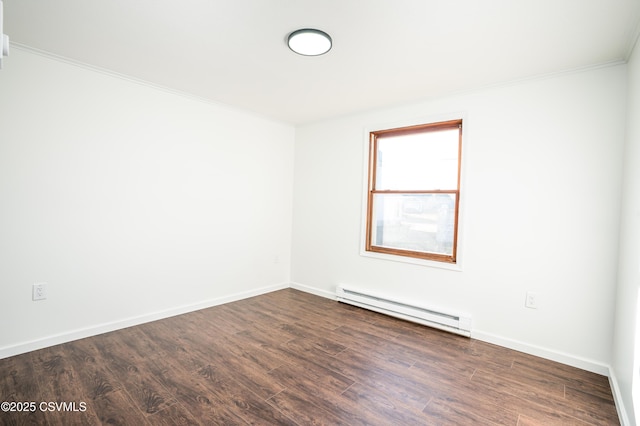 unfurnished room with dark wood-style floors, crown molding, a baseboard heating unit, and baseboards