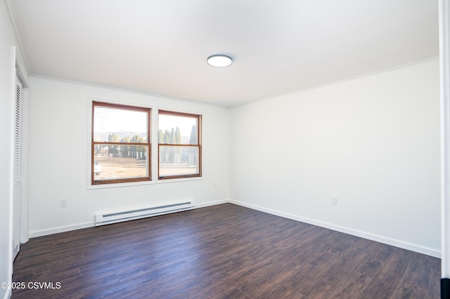 unfurnished room featuring crown molding, baseboards, dark wood-style flooring, and baseboard heating