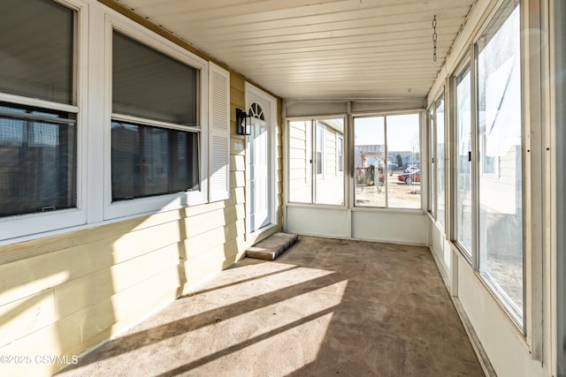 unfurnished sunroom with plenty of natural light