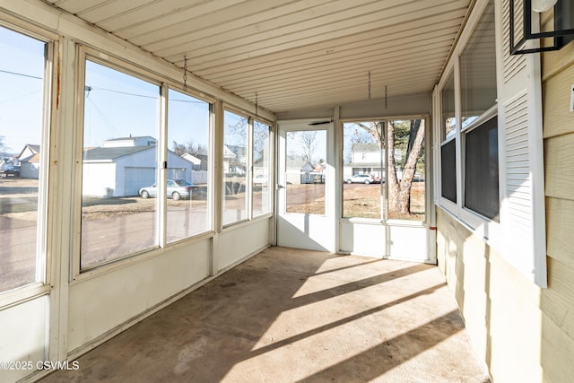 sunroom featuring a residential view