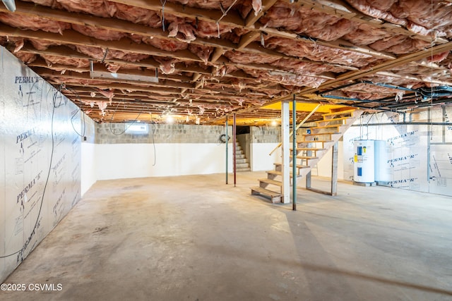 unfinished below grade area with stairs and electric water heater