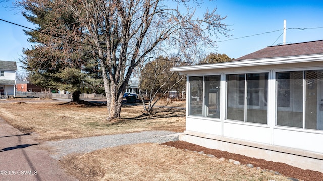 view of yard featuring a sunroom