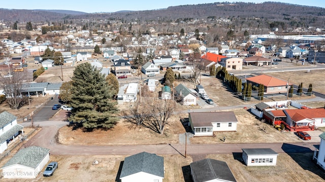 birds eye view of property with a mountain view and a residential view