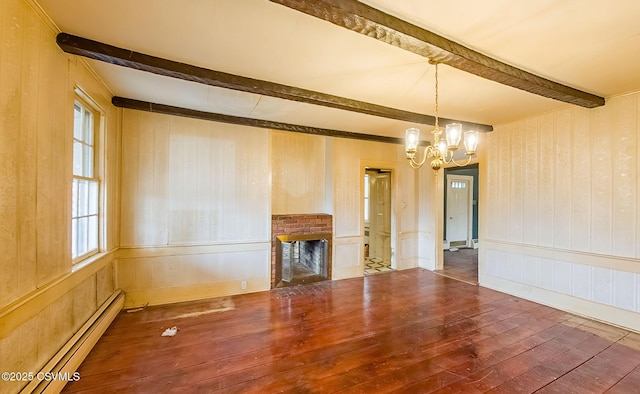 575 Crestwood Dr, Bloomsburg, PA 17815 - unfurnished living room featuring a baseboard radiator, an inviting chandelier, beam ceiling, a fireplace, and hardwood / wood-style flooring