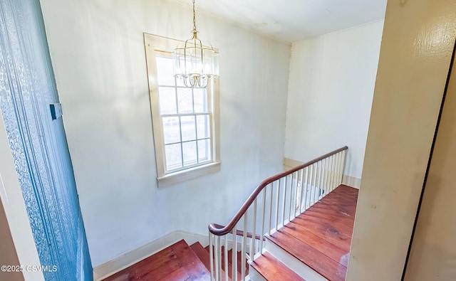 575 Crestwood Dr, Bloomsburg, PA 17815 - stairway with a chandelier, baseboards, and wood finished floors
