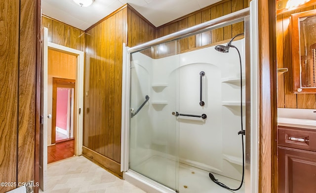 575 Crestwood Dr, Bloomsburg, PA 17815 - bathroom featuring wooden walls, a shower stall, and vanity