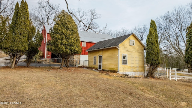 575 Crestwood Dr, Bloomsburg, PA 17815 - view of side of home featuring a yard, an outbuilding, and fence